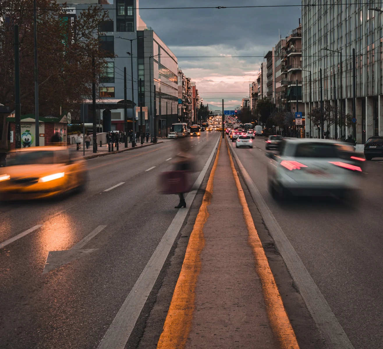 a city street in Athens filled with lots of traffic